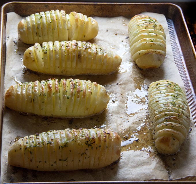 Holiday Hasselback Potatoes are the perfect holiday side dish, especially when they're basted with shallot chive butter while they cook!