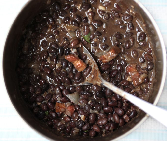 Cuban black beans are the quintessential side dish with many Latin recipes but we don't always have time to use dried beans which need an overnight soak and hours of cooking. When you want your black beans fast, this recipe will give you delicious Cuban Black Beans in 35 minutes l www.panningtheglobe.com