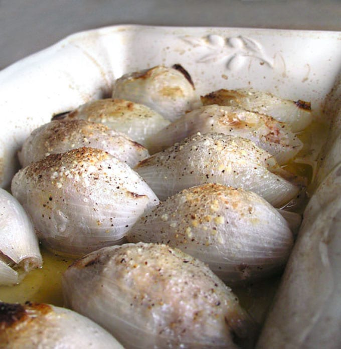 Osh Pyozee are Afghan Stuffed Onions. Soft onion layers are used as a wrapper for a savory lamb, Feta and prune filling. Serve one as an appetizer, 2 or 3 as a main dish l www.panningtheglobe.com 
