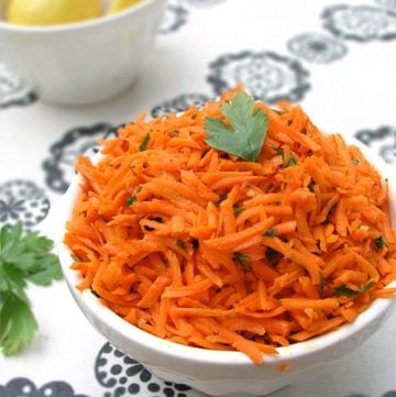 Moroccan Raw Carrot Salad Recipe: Shredded carrots tossed with olive oil, lemon juice, cumin and garlic - a great side dish in 15 minutes!