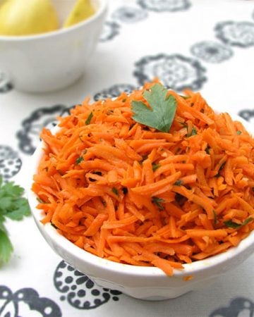 Moroccan Raw Carrot Salad Recipe: Shredded carrots tossed with olive oil, lemon juice, cumin and garlic - a great side dish in 15 minutes!