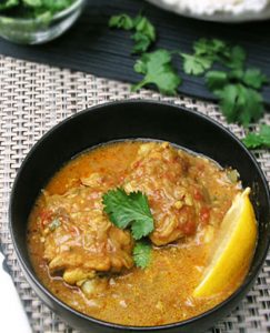 This one pot coconut chicken curry recipe highlights the deliciousness of East African cuisine. Chicken thighs are simmered coconut curry sauce with ginger, garlic, crushed tomatoes and fragrant spices, and topped with crushed peanuts and chopped cilantro for a tasty final layer of flavor.