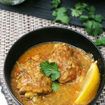 This one pot coconut chicken curry recipe highlights the deliciousness of East African cuisine. Chicken thighs are simmered coconut curry sauce with ginger, garlic, crushed tomatoes and fragrant spices, and topped with crushed peanuts and chopped cilantro for a tasty final layer of flavor.