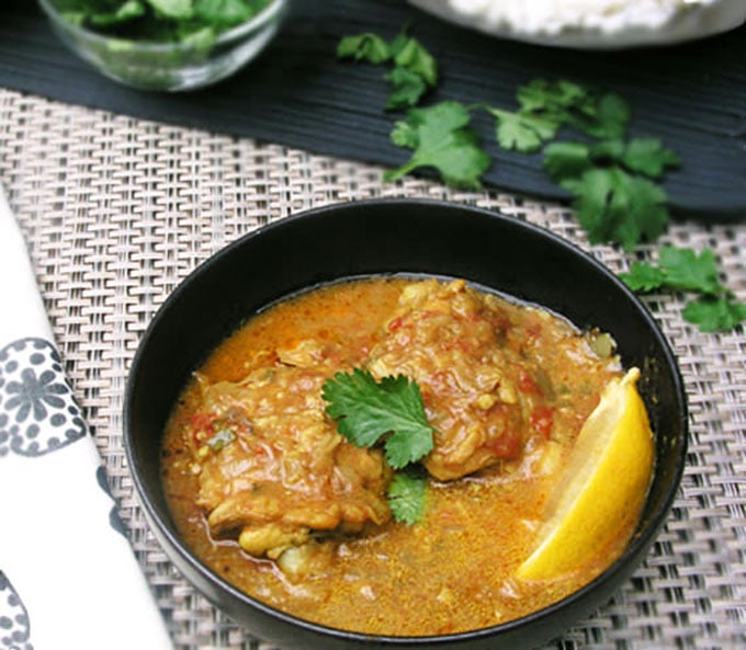 This one pot coconut chicken recipe highlights the deliciousness of East African cuisine. Chicken thighs are simmered coconut curry sauce with ginger, garlic, crushed tomatoes and fragrant spices, and topped with crushed peanuts and chopped cilantro for a tasty final layer of flavor.