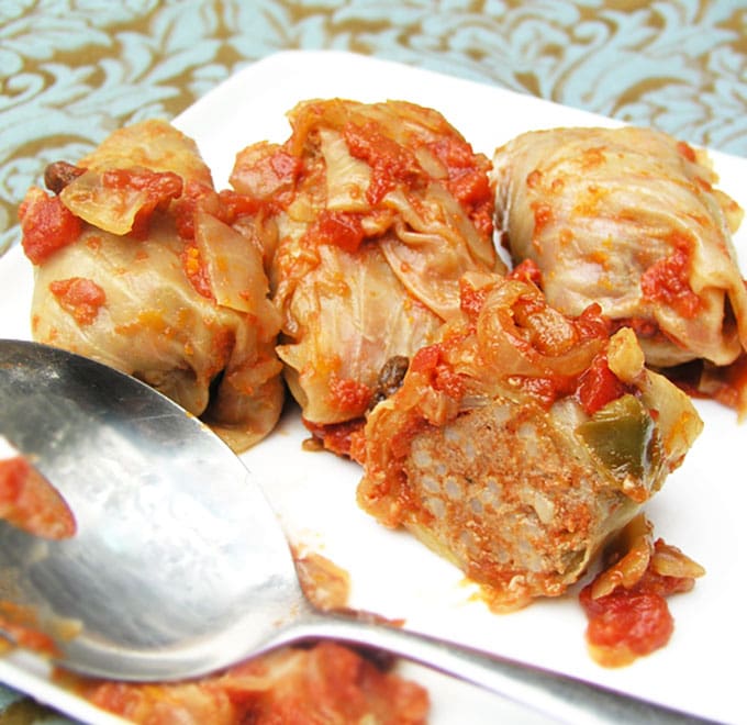 An authentic recipe for Russian Stuffed Cabbage: beef and rice rolled in cabbage leaves and braised in a sweet and sour tomato sauce. Make ahead. | Panning The Globe