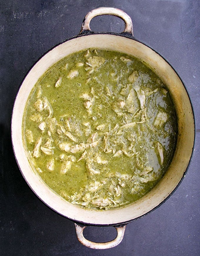 Guatemalan Green Chicken Stew recipe - Tender chicken simmered in a tomatillo cilantro sauce, thickened with toasted ground pumpkin seeds and sesame seeds. A delicious festive healthy soup/stew that also low fat, gluten free and paleo friendly.