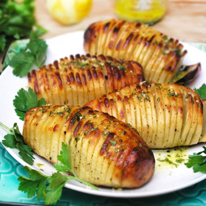 Swedish Hasselback Potatoes with lemon garlic dijon vinaigrette baked in. Learn how to transform an ordinary potato into something spectacular | Panning The Globe