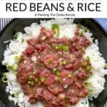 Pinterest pin: A black bowl filled with red beans and rice sprinkled with chopped scallions, 5 forks in corner pointing towards the bowl