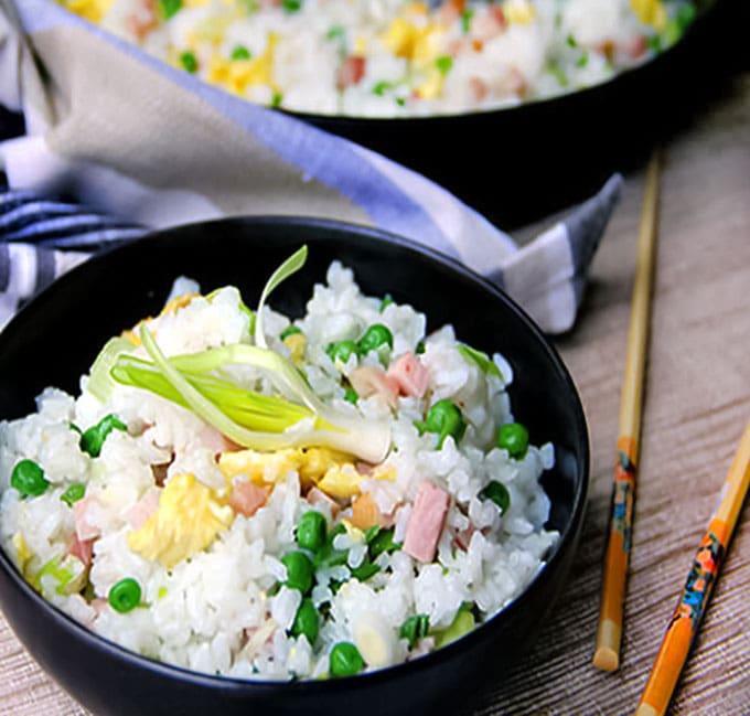 This authentic Chinese ham and egg fried rice recipe has only 5 ingredients, plus oil to stir-fry and salt to season, and no soy sauce. You haven't tasted great fried rice until you've tried this recipe. It's the absolute best!