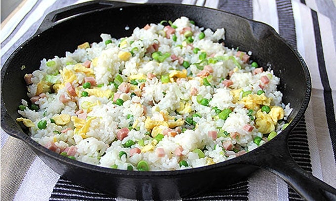 This authentic Chinese ham and egg fried rice recipe has only 5 ingredients, plus oil to stir-fry and salt to season, and no soy sauce. You haven't tasted great fried rice until you've tried this recipe. It's the absolute best!