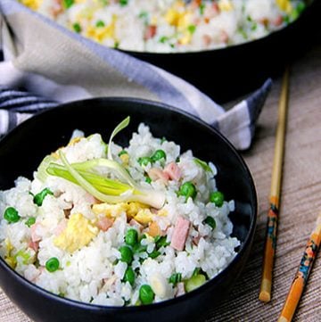 This authentic Chinese ham and egg fried rice recipe has only 5 ingredients, plus oil to stir-fry and salt to season, and no soy sauce. You haven't tasted great fried rice until you've tried this recipe. It's the absolute best!