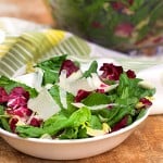 Here’s a salad to brighten your day. Italy's famous Insalata Tricolore mimics the colors of the Italian flag. There are no frills, just a bowl of lettuces, a mustard-lemon vinaigrette, and a garnish of shaved parmesan. This salad works so well because of the strong personality of each type of lettuce, and how well they complement each other.