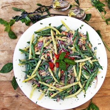 This three bean salad recipe is packed with delicious nutritious vegetables, fresh basil, and a and a tasty lemony yogurt dressing - panningtheglobe.com