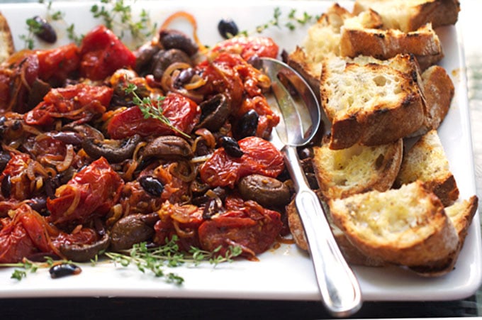 Roasted tomatoes and mushrooms with grilled bread is the absolute BEST spring and summer appetizer. It's like the most delicious bruschetta ever! - Panning The Globe Recipe