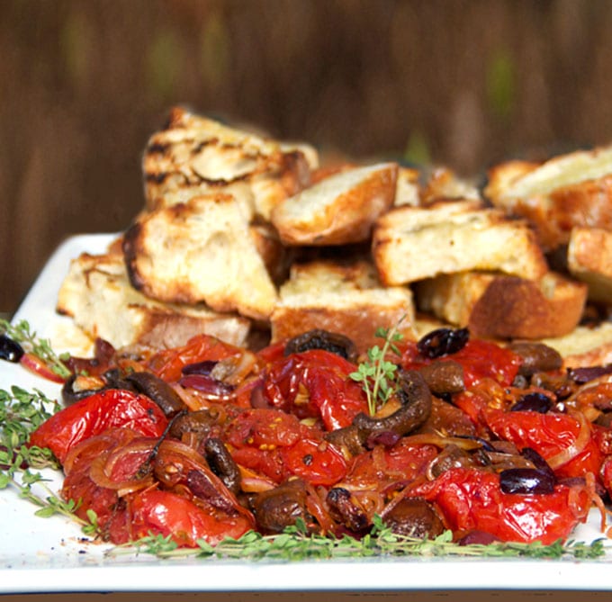 Roasted tomatoes and mushrooms with grilled bread is the absolute BEST spring and summer appetizer. It's like the most delicious bruschetta ever! - Panning The Globe Recipe