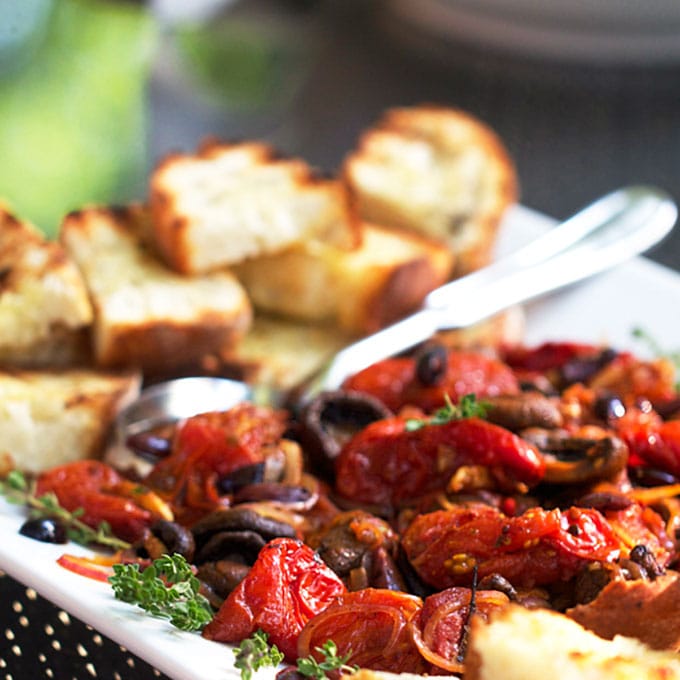 Roasted tomatoes and mushrooms with grilled bread is the absolute BEST spring and summer appetizer. It's like the most delicious bruschetta ever! - Panning The Globe Recipe