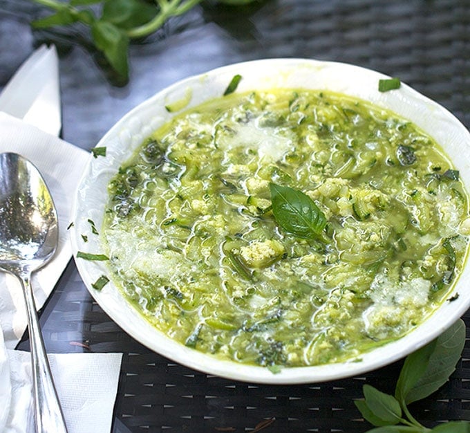  Italian zucchini egg drop soup recipe topped with basil