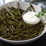 Spicy, flavorful, grilled green beans are an addictive healthy appetizer. Fresh green beans are tossed with homemade Indonesian satay spice mix and grilled. Serve with lemony, garlicky aioli to dip.