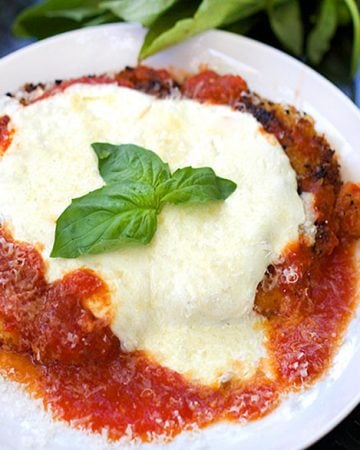 Chicken Parmesan - tender breaded chicken cutlets, crisp on the outside, drenched in delicious tomato sauce and topped with mozzarella cheese | Panning The Globe