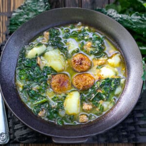 bowl of caldo verde - Portuguese sausage, kake, potato soup.