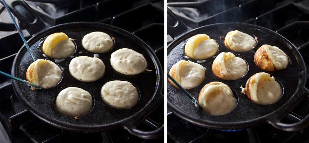 a pair of knitting needles turning the pancake batter in an aebleskiver pan to make pancake balls