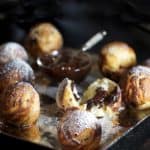 silver platter with chocolate filled aebleskiver pancake balls