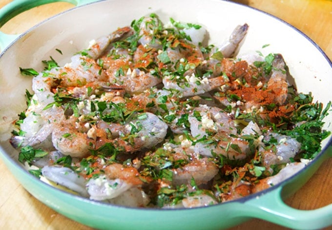 raw shrimp, garlic, parsley and spices in a casserole