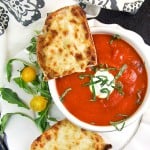 Grilled cheese with tomato soup is the ultimate comfort food pairing and the perfect lunch combo. Here's a special recipe for delicious spiced-up tomato soup and open-face oven grilled cheese with some special secret ingredients that make it extra tasty.