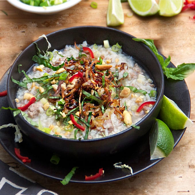 This Cambodian Pork Rice Soup is hearty and thick with tender rice, garlicky ground pork and an assortment of tasty toppings. It's a nourishing one-dish dinner you can make in under an hour I panningtheglobe.com