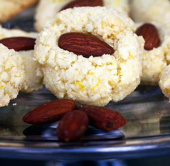 close up shot of one flourless almond cookie.