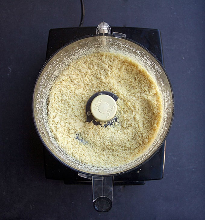 overhead shot of a food processor bowl with ground almonds