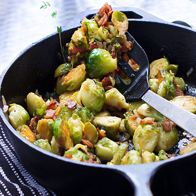 Skillet brussels sprouts, browned and caramelized with bacon, shallots & sherry vinaigrette. A super flavorful side dish recipe worthy of a special occasion