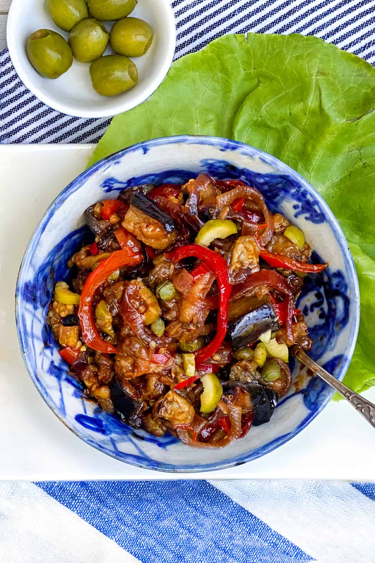 bowl filled with caponata, eggplant and bell pepper relish