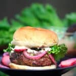 Burger in a bun with pickled onions and miso mayonnaise