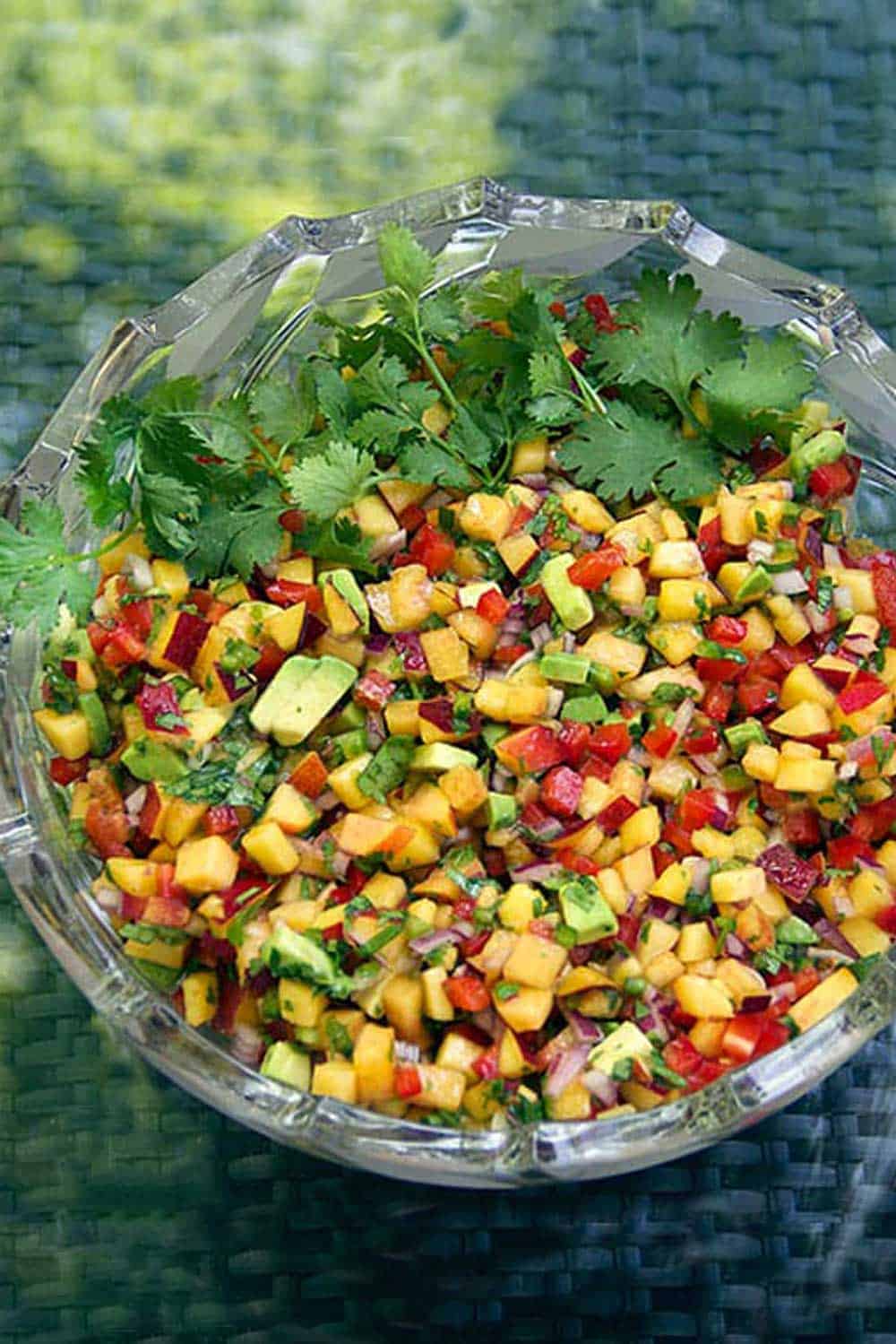 crystal bowl filled with colorful salsa