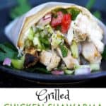 grilled chicken shawarma and chopped salad wrapped in a pita