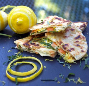 These Smoked Salmon Quesadillas are a fantastic brunch recipe that's easy to prep ahead and is a huge crowd pleaser. Crisp tortillas filled with smokey salmon, creamy tangy goat cheese, lemon zest and slivered basil.