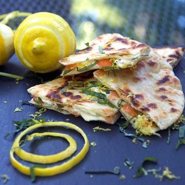 These Smoked Salmon Quesadillas are a fantastic brunch recipe that's easy to prep ahead, and they're a huge crowd pleaser. Crisp tortillas filled with smokey salmon, creamy tangy goat cheese, lemon zest and slivered basil.