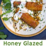 pinterest pin: honey glazed roasted pineapple with yogurt and chopped pistachios