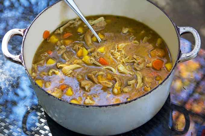 A pot of Jamaican Curried Chicken Stew with Rum and Mango