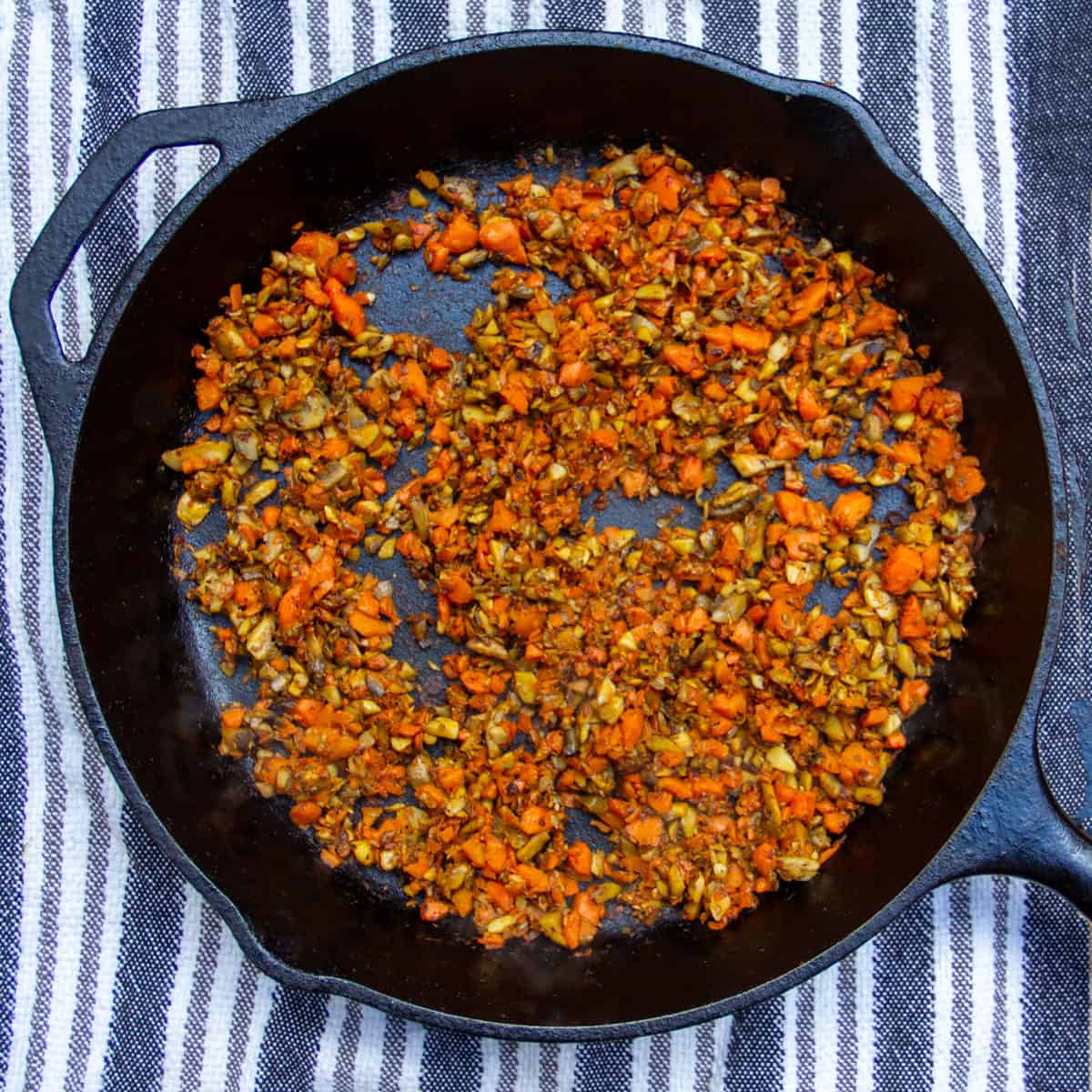 finely chopped caramelized carrots and mushrooms in a cast iron skillet