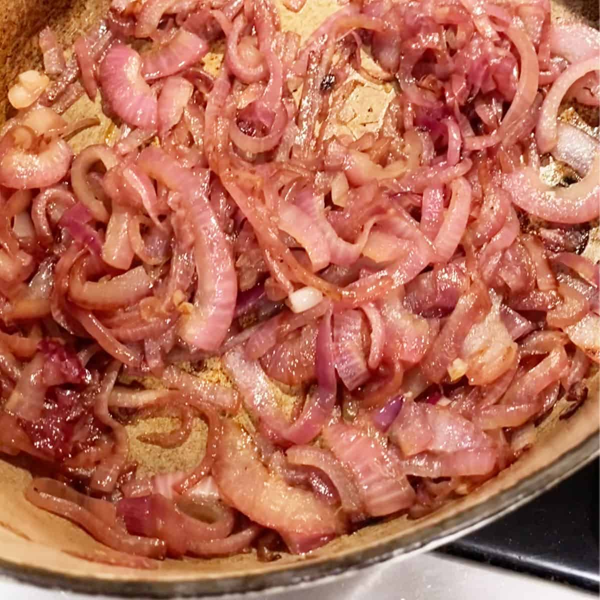Sautéed red onions in a dutch oven.