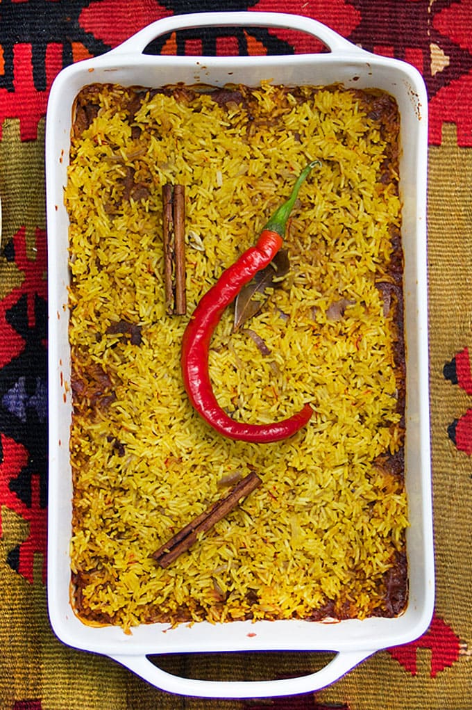 Indian Lamb Biryani is a casserole of tender lamb curry and fragrant saffron rice. Two outstanding dishes combined into one company worthy casserole. Serve with cooling cucumber raita on the side.