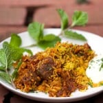 Indian Lamb Biryani: Sumptuous casserole of tender lamb curry with saffron spiced rice with cucumber-mint raita on the side|Panning The Globe