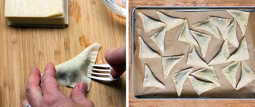 close up of a fork used to crimp and seal a turkey kreplach (dumpling) and then a rimmed baking sheet filled with more than a dozen little triangular turkey dumplings