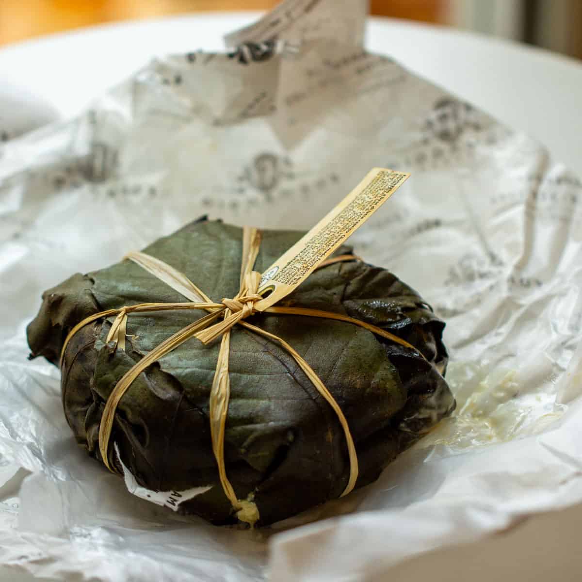 Castagnino cheese wrapped in chesnut leaves and tied with raffia