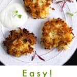 Pinterest pin: 3 latkes on a plate with sour cream