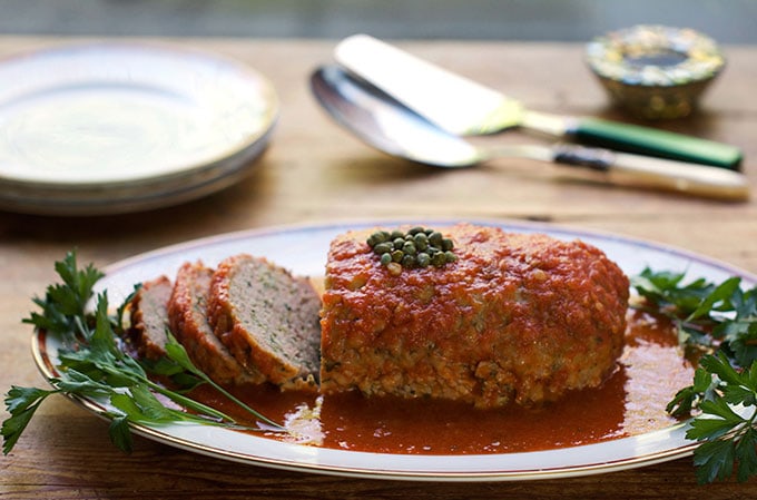 This Sicilian Turkey Meatloaf is extra tender and delicious because the ground turkey is mixed with mashed potatoes (instead of breadcrumbs) and then simmered in wine-scented tomato sauce. 