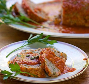 This Sicilian Turkey Meatloaf is unique and incredibly delicious: ground turkey mixed with mashed potatoes and simmered in wine-scented tomato sauce.