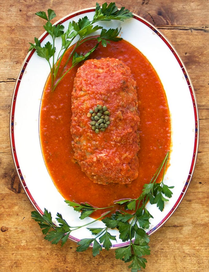 This Sicilian Turkey Meatloaf is unique and incredibly delicious: ground turkey mixed with mashed potatoes and simmered in wine-scented tomato sauce. 